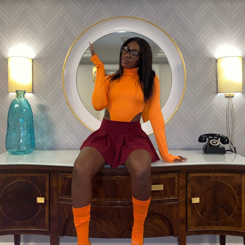 Orange turtle neck high cut bodysuit